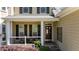 Inviting front porch with seating area and classic architectural details at 624 Moultonboro Ave, Wake Forest, NC 27587