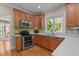 Modern kitchen featuring stainless steel appliances and bright countertops at 624 Moultonboro Ave, Wake Forest, NC 27587