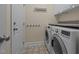 Functional laundry room with modern washer and dryer and ample counter space at 624 Moultonboro Ave, Wake Forest, NC 27587