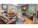 Inviting living room with a stone fireplace, leather seating, and an open layout at 624 Moultonboro Ave, Wake Forest, NC 27587