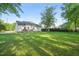 Manicured backyard featuring large lawn and deck at 6324 Daybreak Dr, Wake Forest, NC 27587