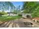 Spacious backyard featuring a charming fire pit and shed at 6324 Daybreak Dr, Wake Forest, NC 27587