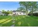 Wide backyard featuring stone path and deck at 6324 Daybreak Dr, Wake Forest, NC 27587