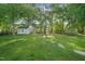 Large backyard with stone pathway and storage shed at 6324 Daybreak Dr, Wake Forest, NC 27587
