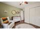 Bedroom featuring a chair, changing table, and closet with a round rug on wood floors at 6324 Daybreak Dr, Wake Forest, NC 27587