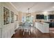 Bright and sunny dining area with large windows and modern lighting at 6324 Daybreak Dr, Wake Forest, NC 27587