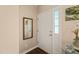 Entryway features a white front door with glass and a mirror on the wall at 6324 Daybreak Dr, Wake Forest, NC 27587