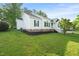 Charming home featuring clean white siding, black shutters, and a well-maintained lawn and landscaping at 6324 Daybreak Dr, Wake Forest, NC 27587