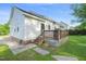 Exterior side view showing deck, vinyl siding, and brick foundation at 6324 Daybreak Dr, Wake Forest, NC 27587
