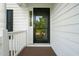 Front entrance featuring a black front door and sidelight at 6324 Daybreak Dr, Wake Forest, NC 27587