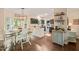 Stylish kitchen and dining area featuring modern lighting, dark cabinetry, and a convenient breakfast bar at 6324 Daybreak Dr, Wake Forest, NC 27587
