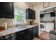 Kitchen featuring granite countertops, stainless steel appliances, and a view to the backyard at 6324 Daybreak Dr, Wake Forest, NC 27587