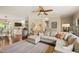 Spacious living room offering hardwood floors and a seamless transition to the kitchen and dining area at 6324 Daybreak Dr, Wake Forest, NC 27587