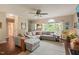 Open-concept living room with hardwood floors, neutral colors, and lots of natural light at 6324 Daybreak Dr, Wake Forest, NC 27587