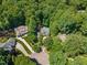 Aerial view of the property that is surrounded by trees and landscaping at 6509 Mountain Brook Ln, Raleigh, NC 27615