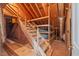 Attic space with unfinished wood, wooden stairs, and exposed beams at 6509 Mountain Brook Ln, Raleigh, NC 27615
