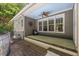 Back porch featuring ceiling fan, craftsman columns, and steps to the back yard at 6509 Mountain Brook Ln, Raleigh, NC 27615