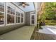 Back porch featuring ceiling fan, craftsman columns, and steps to the back yard at 6509 Mountain Brook Ln, Raleigh, NC 27615