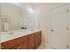 Bathroom with double vanity, granite counters, and tile floors at 6509 Mountain Brook Ln, Raleigh, NC 27615