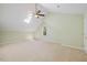 Spacious bedroom with light green walls, plush carpet, a window, and a ceiling fan at 6509 Mountain Brook Ln, Raleigh, NC 27615