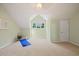 Cozy bedroom featuring light green walls, plush carpeting, window, and a modern art print at 6509 Mountain Brook Ln, Raleigh, NC 27615