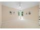 Bright bedroom featuring neutral walls, carpet, ceiling fan, and natural light from the double windows at 6509 Mountain Brook Ln, Raleigh, NC 27615