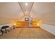 A large bonus room has hardwood floor and paneling and lots of space at 6509 Mountain Brook Ln, Raleigh, NC 27615