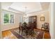 Elegant dining room with tray ceiling, chandelier, and hardwood floors at 6509 Mountain Brook Ln, Raleigh, NC 27615