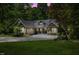 Charming single-story home with manicured lawn, lush landscaping, and a spacious driveway at 6509 Mountain Brook Ln, Raleigh, NC 27615