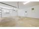 Spacious two-car garage featuring a clean floor and natural light at 6509 Mountain Brook Ln, Raleigh, NC 27615