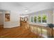 Bright living room with hardwood floors and large windows overlooking the backyard at 6509 Mountain Brook Ln, Raleigh, NC 27615