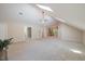 Expansive living room with vaulted ceilings, abundant natural light, and carpet flooring at 6509 Mountain Brook Ln, Raleigh, NC 27615