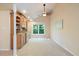 Inviting living room showcases a built-in bar area, carpeted floors, and natural light from the window at 6509 Mountain Brook Ln, Raleigh, NC 27615