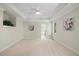 Large main bedroom with neutral carpet, tray ceiling, ensuite bathroom and natural light at 6509 Mountain Brook Ln, Raleigh, NC 27615