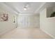 This main bedroom is spacious and bright, with a ceiling fan, large closet, and neutral carpet at 6509 Mountain Brook Ln, Raleigh, NC 27615