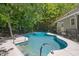 An in-ground swimming pool is surrounded by lush trees at 6509 Mountain Brook Ln, Raleigh, NC 27615