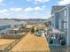 Large backyard with a patio, trampoline, privacy fence, and view of neighboring houses at 6633 Penfield St, Wake Forest, NC 27587