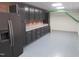 Basement kitchen with appliances, cabinets, and gray flooring at 6633 Penfield St, Wake Forest, NC 27587