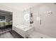 Bright bathroom featuring a separate shower and tub at 6633 Penfield St, Wake Forest, NC 27587
