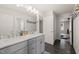 Bright bathroom featuring double vanity, granite countertops, tiled floors, and updated fixtures at 6633 Penfield St, Wake Forest, NC 27587