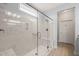 Modern bathroom featuring a large walk-in shower, tile, and glass door at 6633 Penfield St, Wake Forest, NC 27587