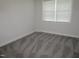 Bright bedroom featuring neutral walls and plush gray carpeting at 6633 Penfield St, Wake Forest, NC 27587