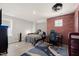 Bedroom featuring an exposed brick wall, ceiling fan, wood floors, and a large rug at 6633 Penfield St, Wake Forest, NC 27587