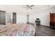 Bedroom suite boasts luxury vinyl plank flooring and a sliding barn door to ensuite bathroom at 6633 Penfield St, Wake Forest, NC 27587