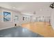 Large bonus room with a mix of epoxy and wood floors, ballet barres and exterior access at 6633 Penfield St, Wake Forest, NC 27587