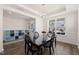 Dining room featuring stylish light fixture, and view to foyer with storage at 6633 Penfield St, Wake Forest, NC 27587
