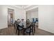 Dining room featuring stylish black table, and view to kitchen at 6633 Penfield St, Wake Forest, NC 27587