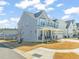 Charming two-story home with a well-manicured front yard and inviting porch at 6633 Penfield St, Wake Forest, NC 27587