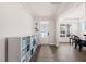 Bright foyer with wood floors, a decorative storage unit, and a view into the adjacent dining room at 6633 Penfield St, Wake Forest, NC 27587