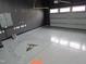 Epoxy floor with colorful artwork and overhead lights at 6633 Penfield St, Wake Forest, NC 27587